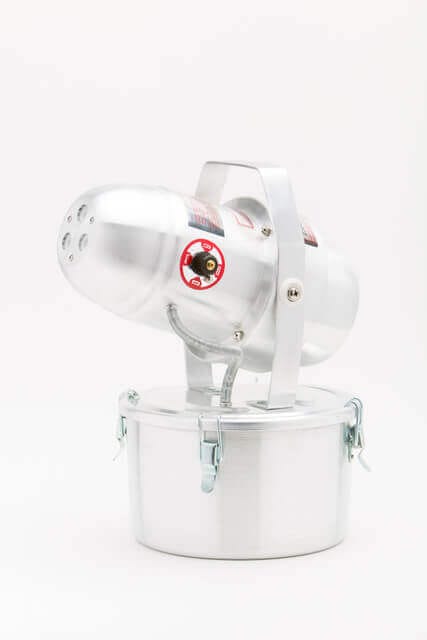 Industrial fogger machine with metal body and handle, isolated on white background, ideal for pest control and sanitization.